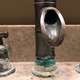 A corroded faucet at a home in The Oaks subdivision